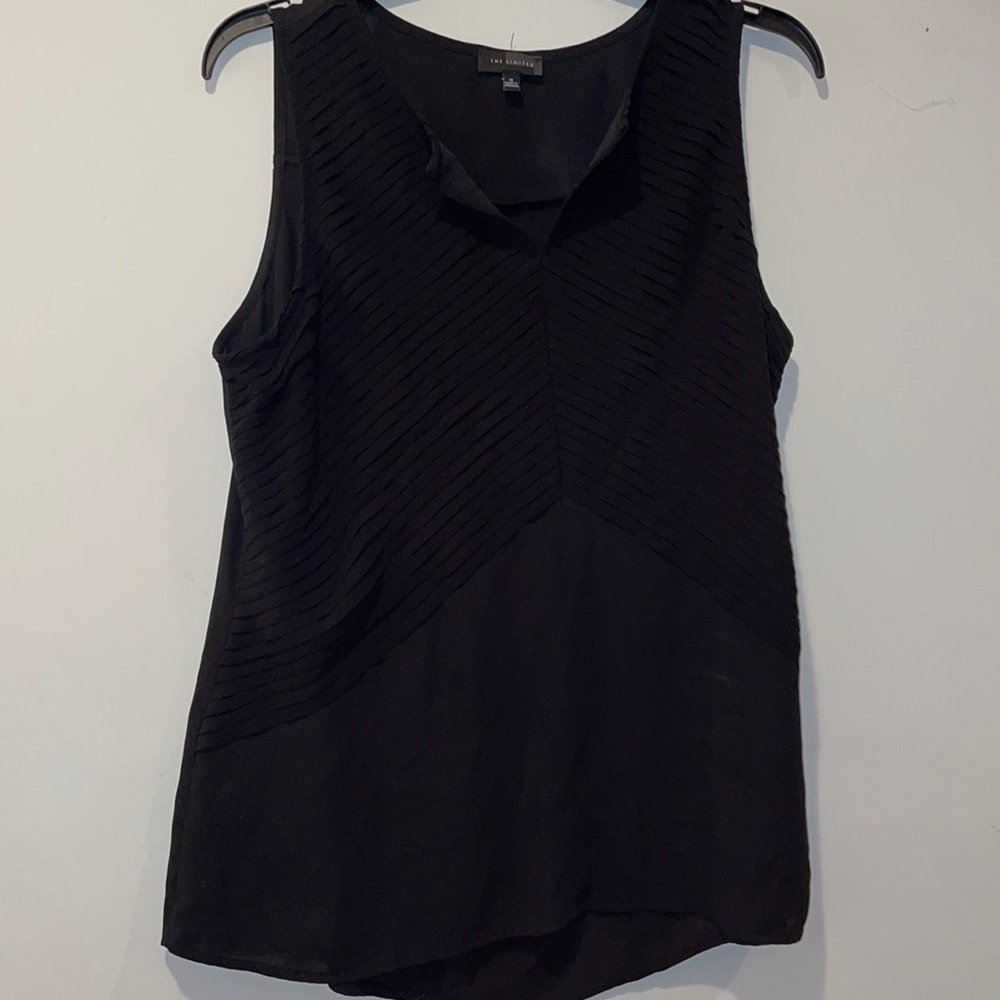 The limited black sleeveless blouse